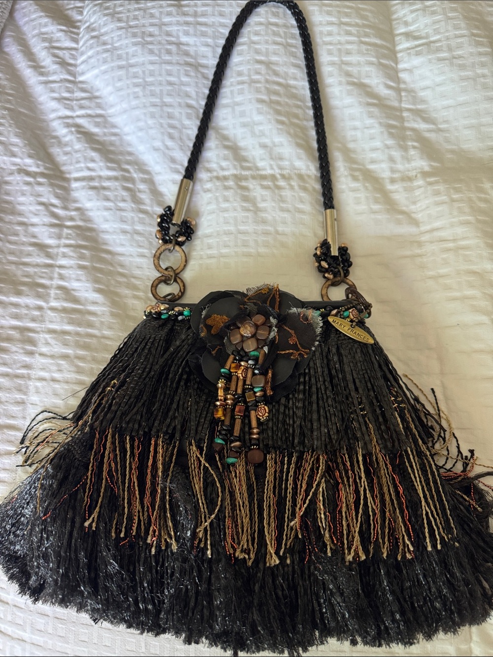 Mary Frances Black Fringe Shoulder Bag with Beaded Floral Accent.